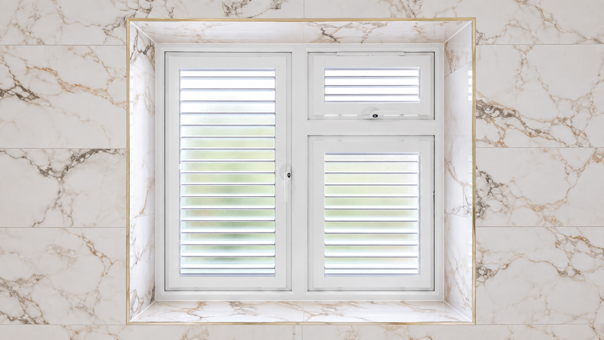 White Perfect Fit shutters fitted to three window panes in a marble surround